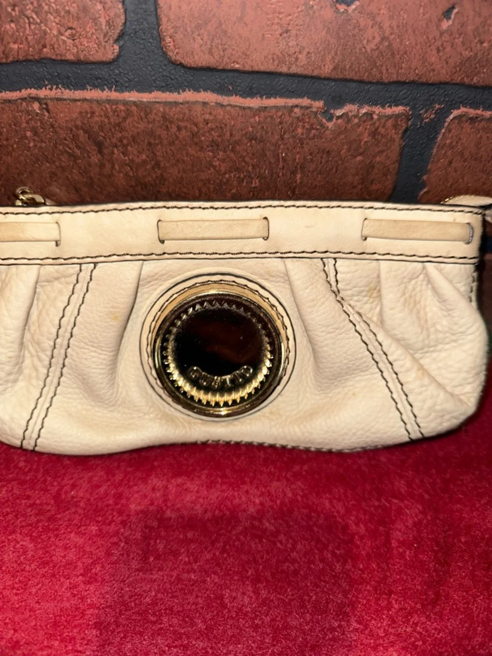 Cream Leather Wristlet Clutch with Gold Medallion Accent